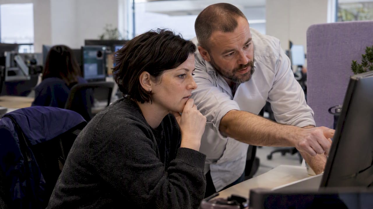 Engineers reviewing a cloud cost recommendation