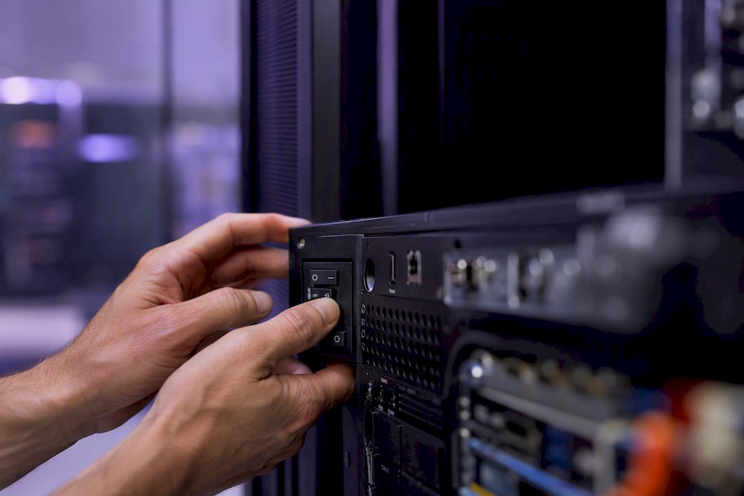 Hands powering off server hardware switch