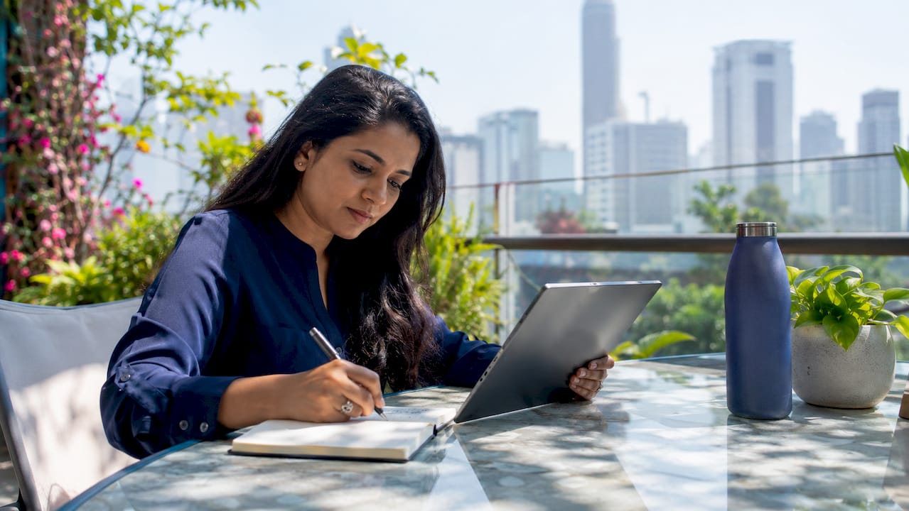 Woman reviewing cloud FinOps launch data