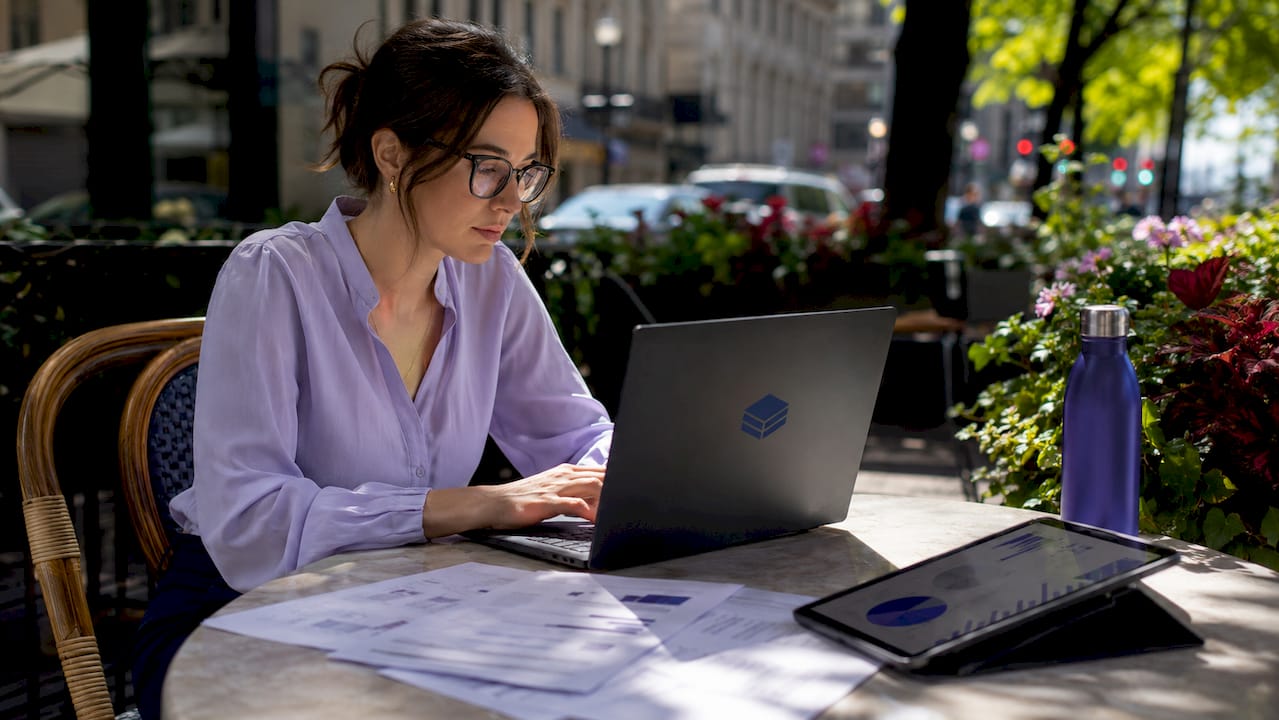 Financial analyst reviewing cloud spend spreadsheets in office