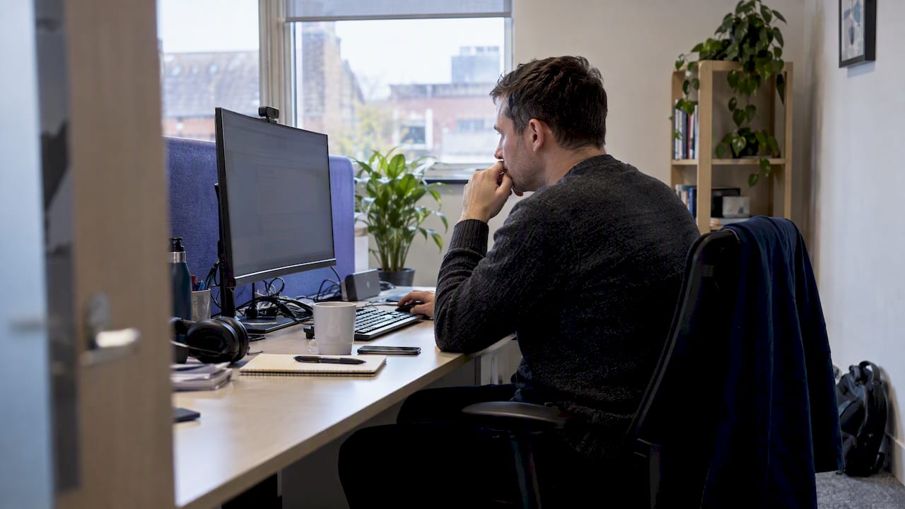 CTO reviewing cloud costs at a workstation