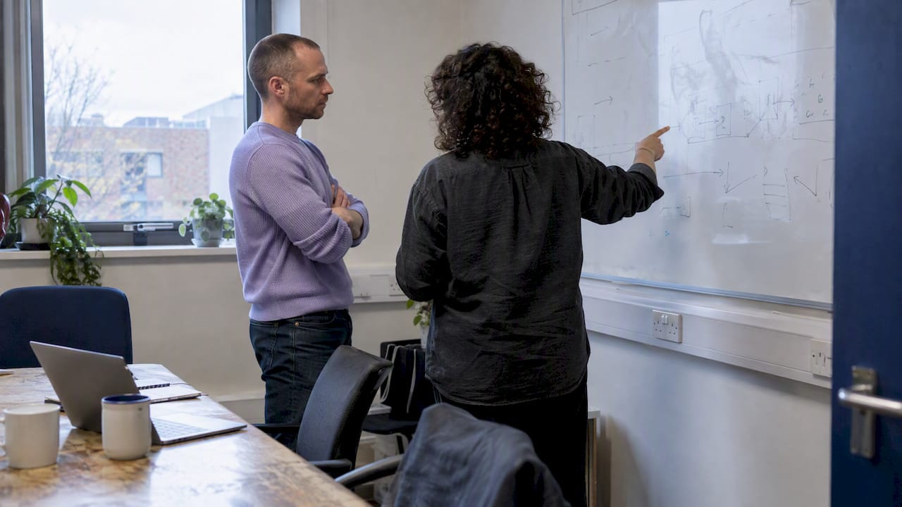 Engineers reviewing a cloud cost policy