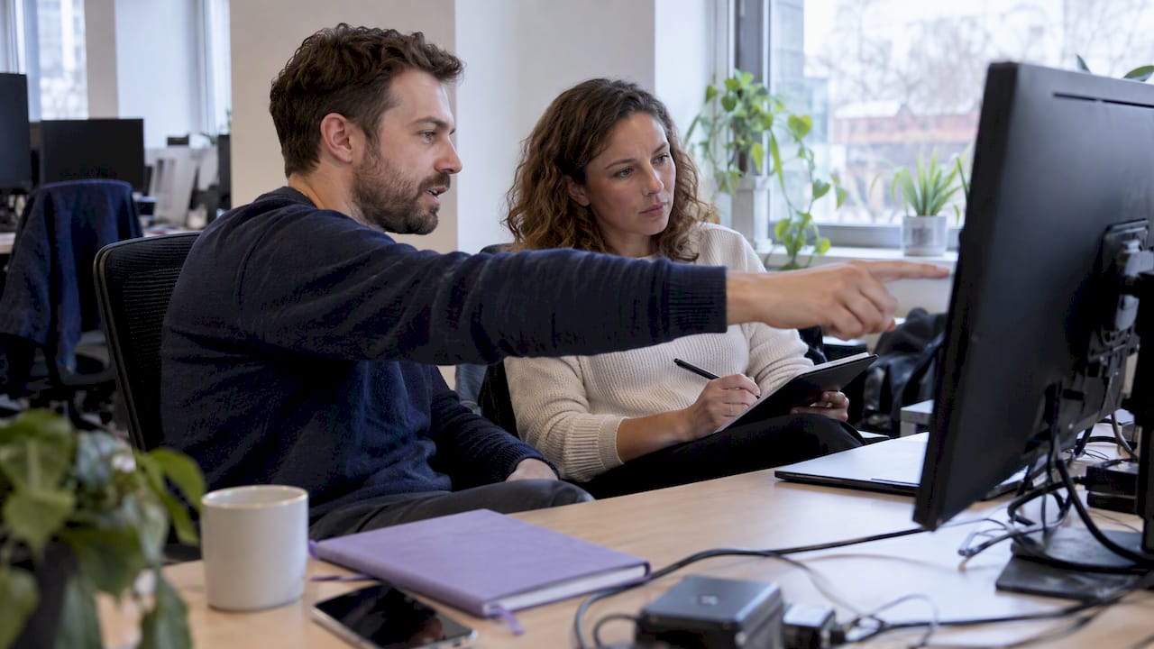 FinOps specialists reviewing cloud development costs