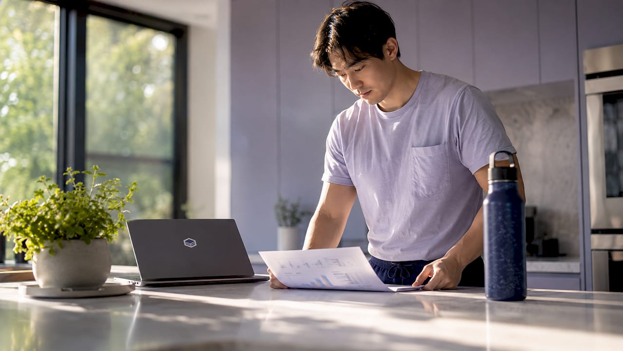 Engineer reviewing cloud waste report at desk
