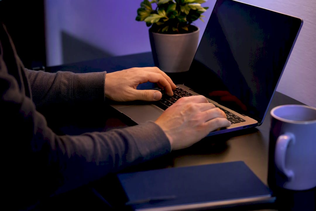 Hands preparing infrastructure-as-code printouts