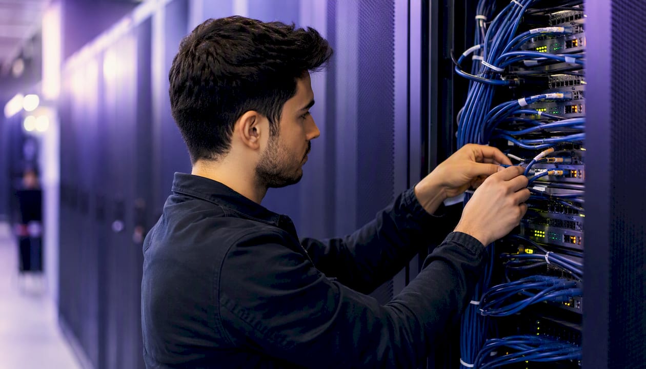 Hands connecting cloud server cables