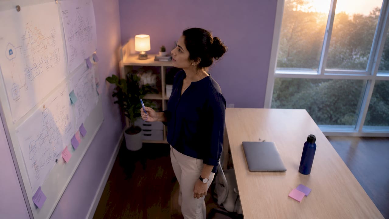 Cloud architect reviewing architecture diagrams