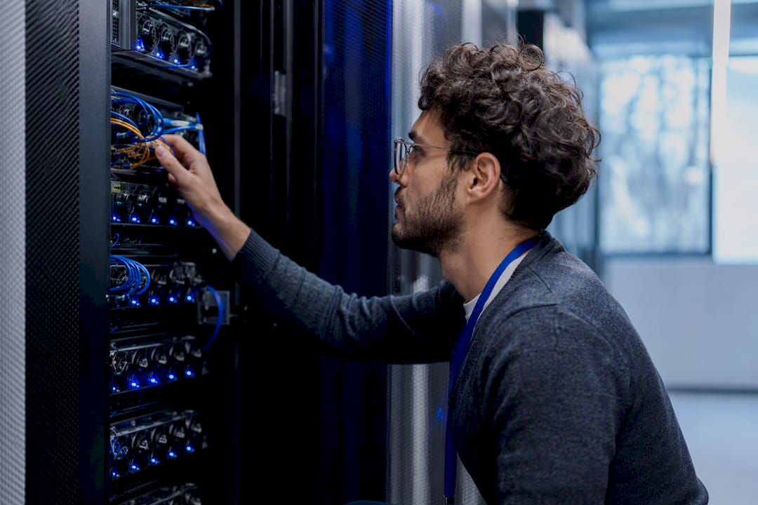 Technician checking cloud data center equipment