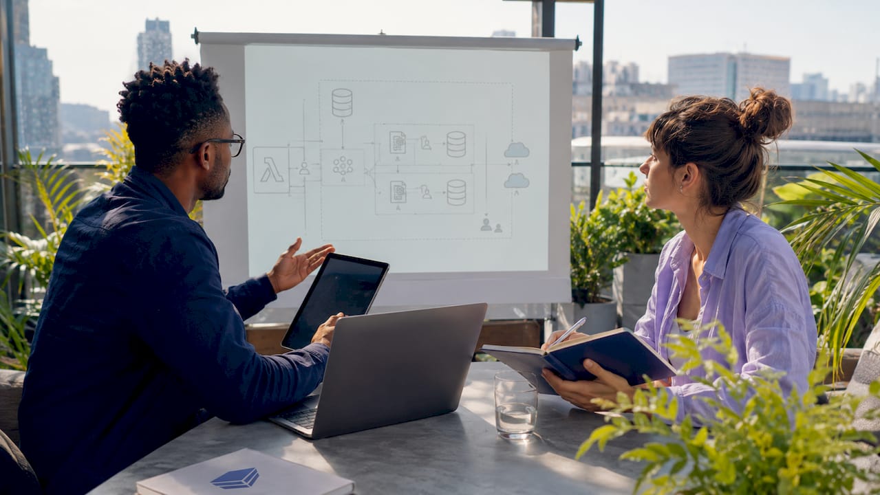 Two architects discussing serverless cloud cost optimization