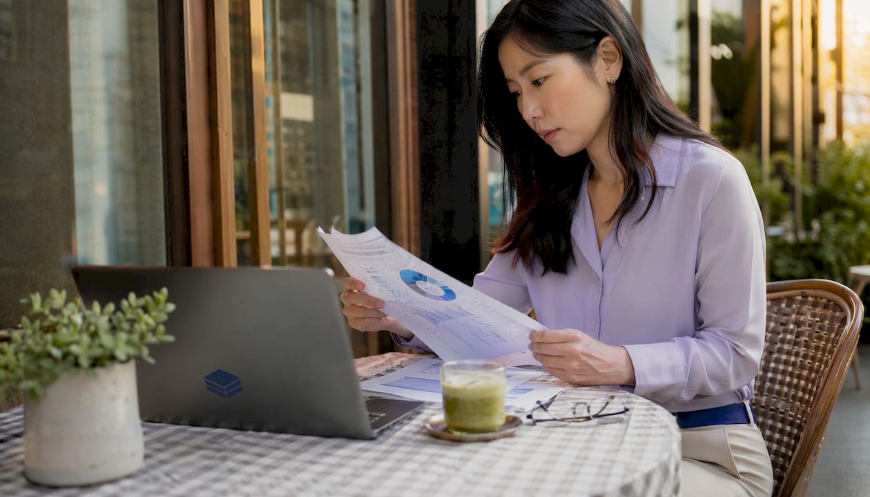 Woman analyzing cloud storage bills at desk